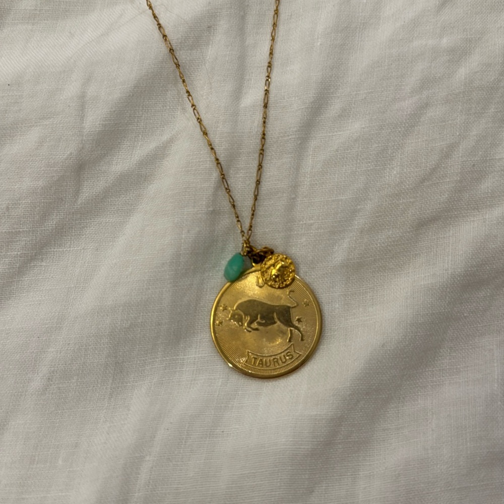 Long gold Taurus necklace